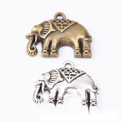 Front and finish comparison of decorated elephant charm