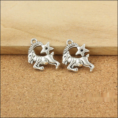 Capricorn Zodiac metal pieces shown in the available finishes.