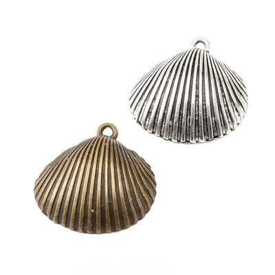 Grouped front view of hinged scallop shell charms in the available finishes