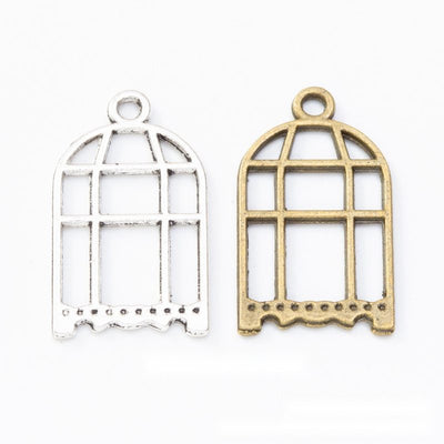 Tall arched cage with open bars and scalloped base shown in the available finishes