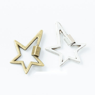 Grouped front views of open star charms