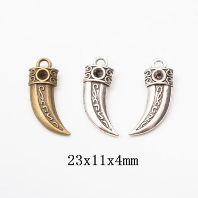 Front view of engraved horn pendant showing finish variation 1