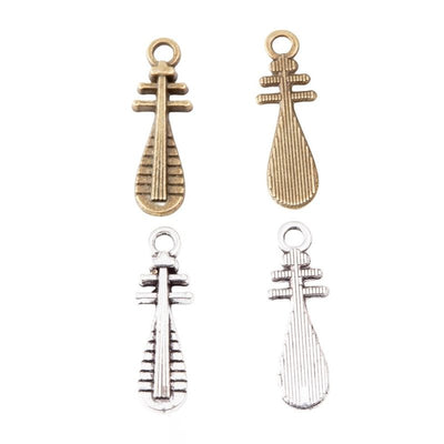 Grouped front views of the chinese lute instrument metal charm in two antique finishes