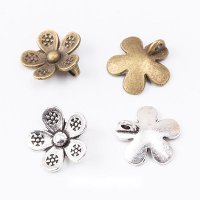 Grouped front views of the five petal flower metal charm in two antique finishes