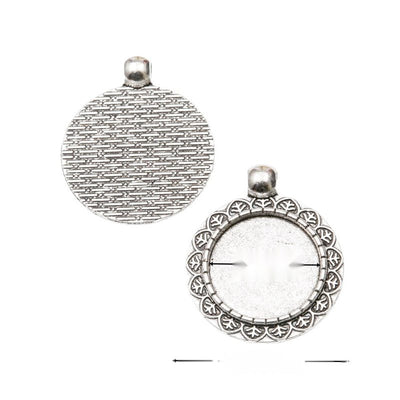 Assorted round cabochon pendant settings arranged together on a white background