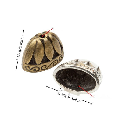 Group view of domed fluted bead cap with an open base and scroll border