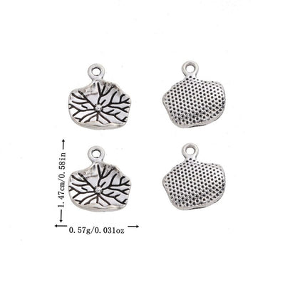 Antique Silver lotus leaf charm shown in an overview