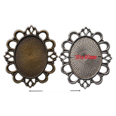 Grouped front views of oval floral bezel settings