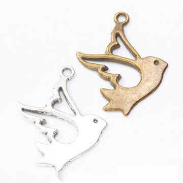 Flying Bird Silhouette Charm in Two Antique Finishes
