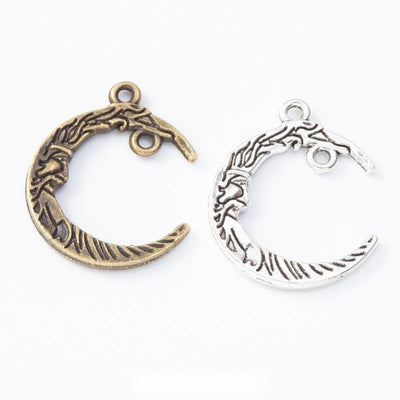 Assorted crescent moon connectors arranged together on a white background
