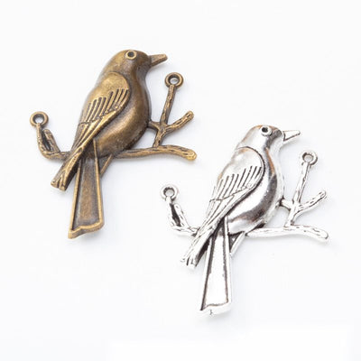 Bird-on-branch connector shown across the available finishes
