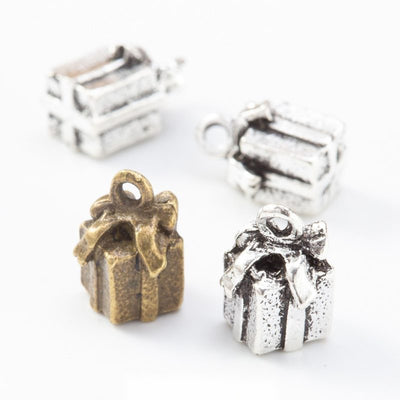 Front view of tiny wrapped gift charm showing finish variation 1