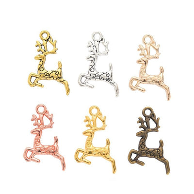 Assorted leaping deer charms arranged together on a white background