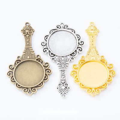 hand mirror round cabochon bezel connectors in three finishes shown together in the available finishes