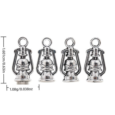 Front display of miniature kerosene lantern charm shown against a plain background.