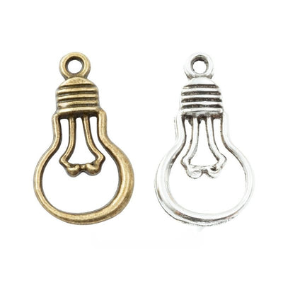Openwork Light Bulb Metal Charms in Two Finishes in multiple metallic finishes displayed together on a white background.