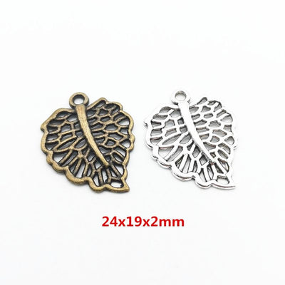 Grouped front view of veined openwork leaf charms in the available finishes