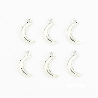 Group view of mini crescent moon charm showing all 1 pictured finish variants