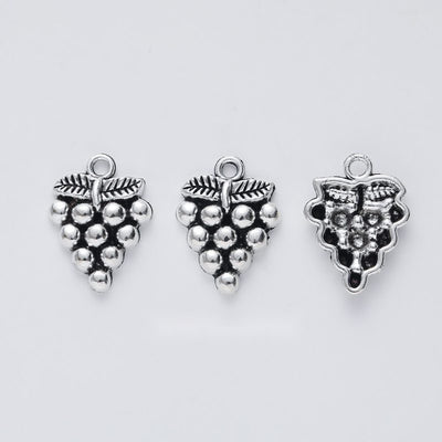 Small Grape Cluster Charm shown in the available metal finishes on white
