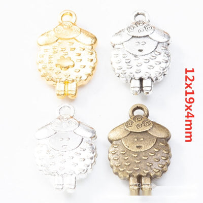 Overview of cartoon sheep charm pieces on a white background