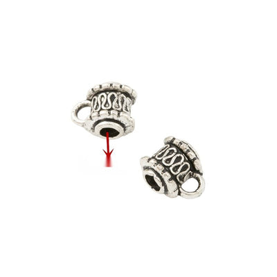 Barrel-shaped large-hole bead with scrolling relief and a hanging loop shown in arranged finish comparison