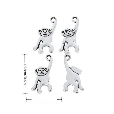 Product image showing the raised arm monkey metal charm and its visible metal details