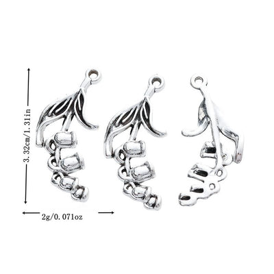Metal trumpet flower charm, front and reverse views shown in the product image