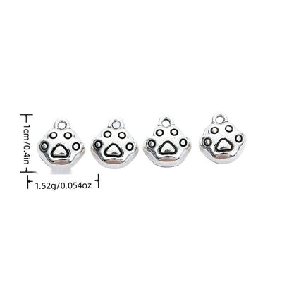 Product image showing the round paw print metal charm and its visible metal details