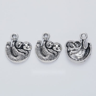 Group view of curled koala charm showing all 1 pictured finish variants