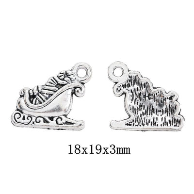 Front-facing arrangement of Christmas sleigh charms on a white background