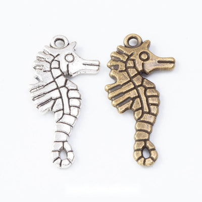 Product photo 1 of the detailed seahorse charm highlighting its curled seahorse silhouette with ridged body details