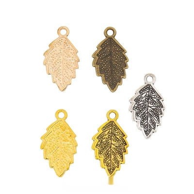 Dotted leaf metal component, grouped front view on white