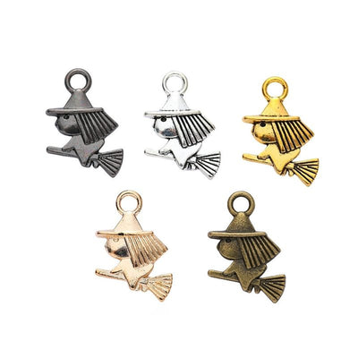 Front view of small witch figure charm showing finish variation 1