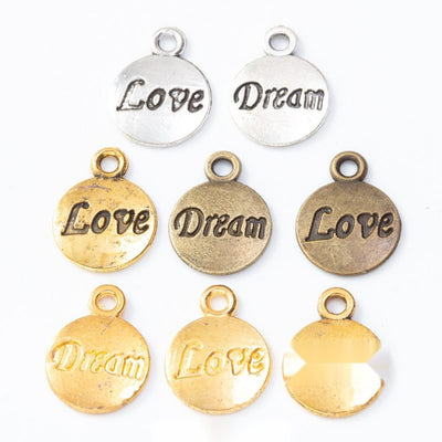 Word Disc Charm grouped finish options on a white background