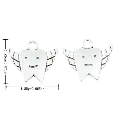 Front and finish comparison of winged tooth charm
