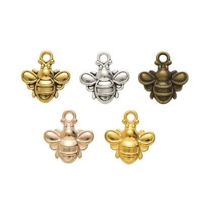 Finish comparison of 立体蜜蜂 charm on a white background