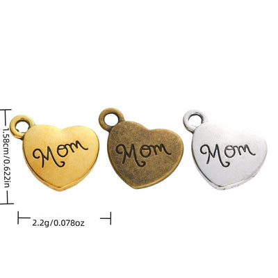 Mom Engraved Heart metal piece shown in Antique Bronze, Antique Gold, Antique Silver beside printed specifications