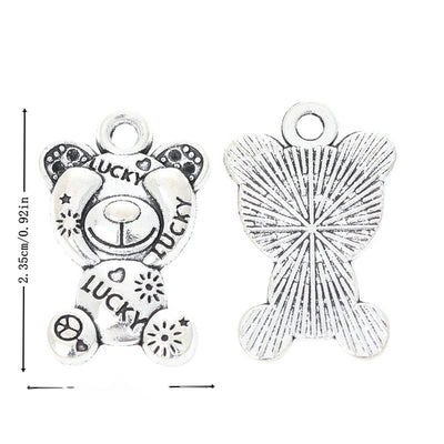 Metal lucky teddy bear charm, front and reverse views shown in the product image