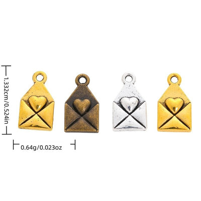 Heart Envelope metal piece shown in Antique Bronze, Antique Gold, Antique Silver beside printed specifications