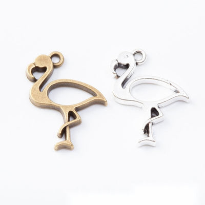 Grouped front view of open flamingo frame charms in the available finishes