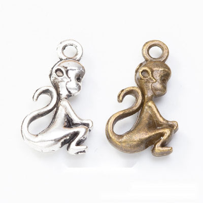 Front comparison of sitting monkey metal component in 2 finishes