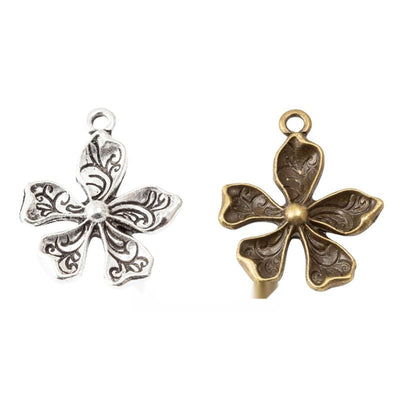 Rounded flower with a raised center shown across the available finishes