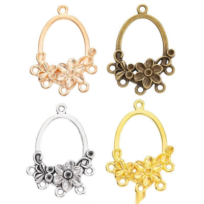 Assorted floral chandelier connectors arranged together on a white background