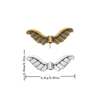 Grouped front view of curved angel wing spacer beads in the available finishes