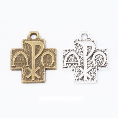 Group view of a cross-shaped plaque carries a raised chi rho monogram and top loop