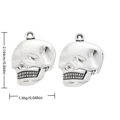 Product image showing the grinning skull head metal charm and its visible metal details