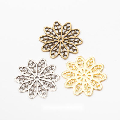 Grouped front views of openwork flower charms