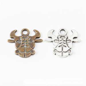 Ox Head Charm with Engraved Face in Two Antique Finishes