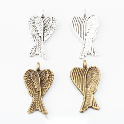 Product photo 1 of the folded angel wings charm highlighting its paired feathered wings folded into a tapered silhouette