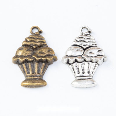 Product view of cupcake charm showing a cupcake with a fluted base, layered frosting, and a top loop